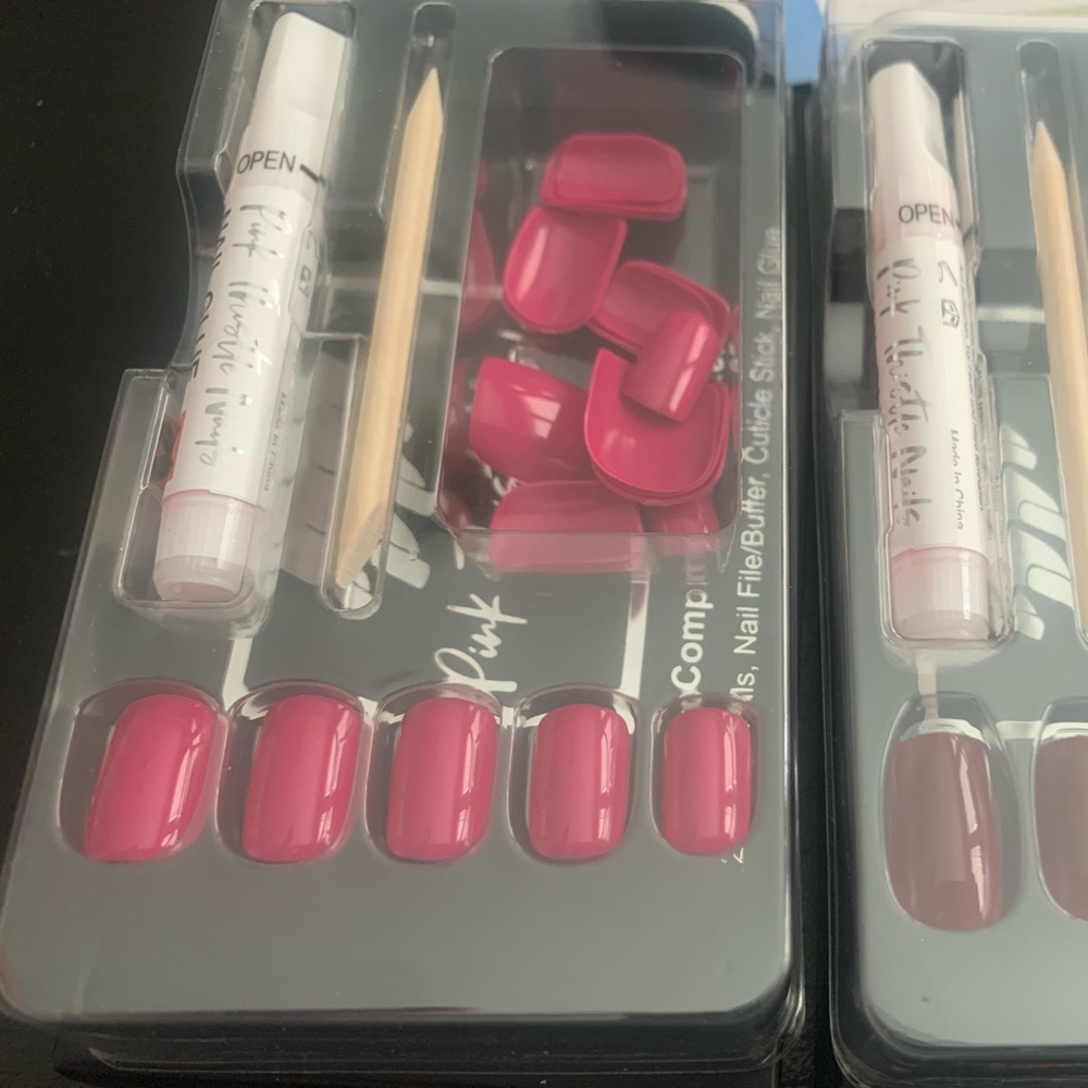 Pink glue on nails